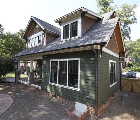 metal roof on green sided craftsman house|house with green roof colors.